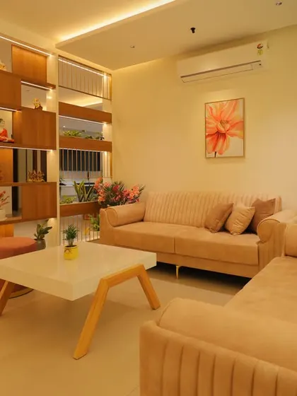 Another view of the living room with the planter partition, showing how it creates a sense of openness while defining the area.