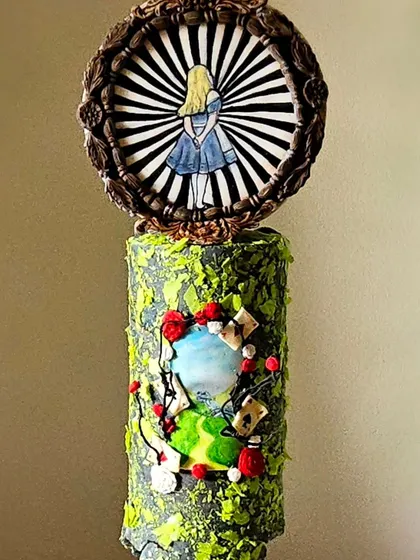 Another view of the "Alice in Wonderland" cake, showcasing the unique texture and hand-painted details that earned it a feature in a prestigious cake magazine.