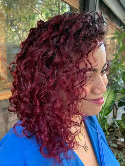 Pomegranate Sangria. Painted these gorgeous curly locks with different shades of red and a pop of pink. A little bleach was used. (No filter)