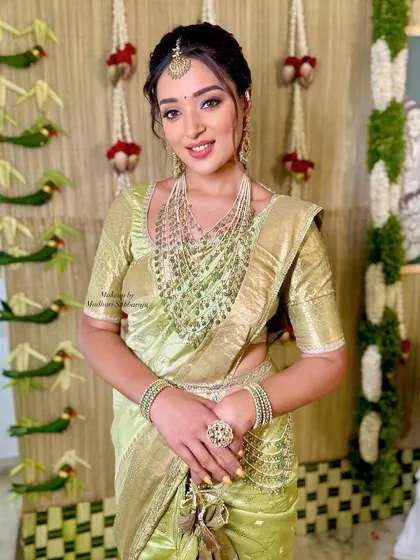 A happy and confident bride, ready for her ceremony. The makeup is bright and fresh, enhancing her natural glow.