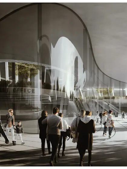 The curved glass facade of the station reflects the sky and surrounding greenery, creating a dynamic and ever-changing appearance.