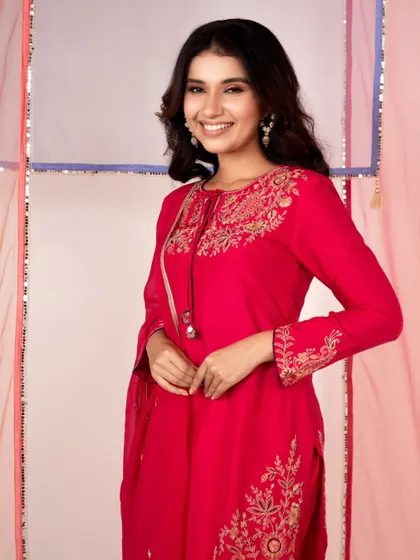 A bright and happy e-commerce shot for a festive kurta set. The model's smile makes the image feel friendly and approachable.