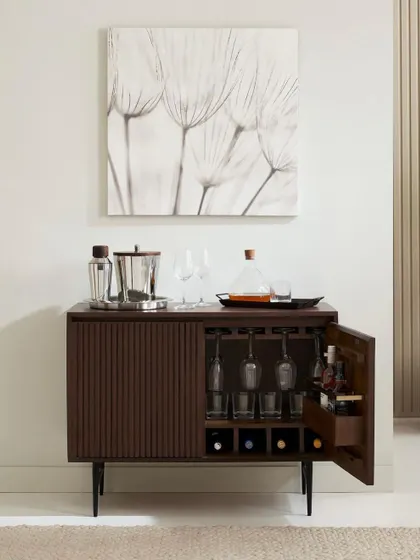 Clean, elegant, and functional. This shot of a slatted bar cabinet shows my approach to classic furniture photography. The focus is on the product's design, material, and utility, presented in a beautifully styled yet straightforward context for catalog and e-commerce use.