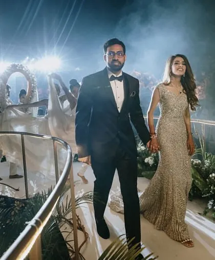 The couple's grand entrance, framed by performers and dramatic lighting, showcases the dynamic and celebratory atmosphere we create.