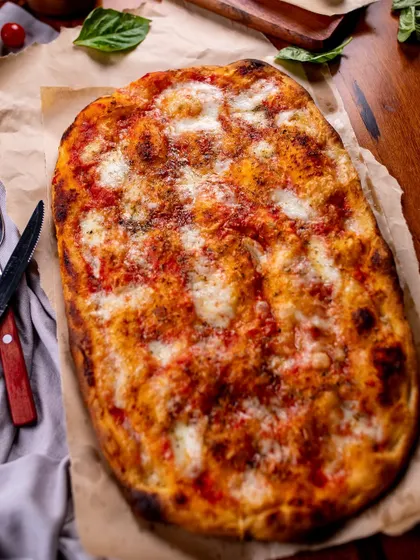 Our Pizza Alla Pala, with its unique rectangular shape and airy crust. A must-try!
