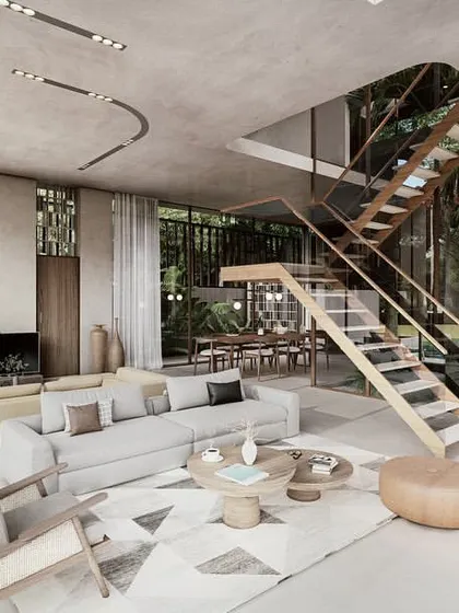 The living and dining area of a Pavilion home is a large, open space defined by a central courtyard and a floating staircase. The design prioritizes light, volume, and views, creating a serene and expansive interior.