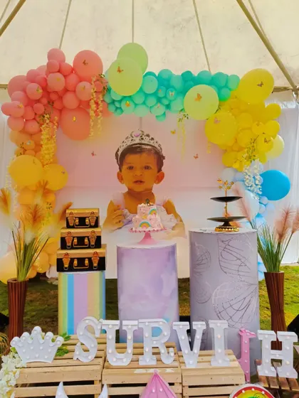 The complete outdoor party setup for Survi, including props and personalized letters.
