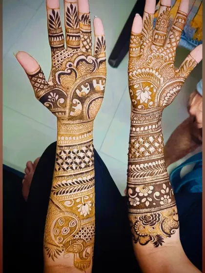 This is a classic example of my traditional bridal work. It features auspicious elephant motifs for good luck and prosperity, along with intricate jaali patterns and floral vines covering the hands and forearms.