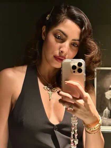 A selfie moment with our classic diamond cross necklace, a piece that is both personal and stylish.