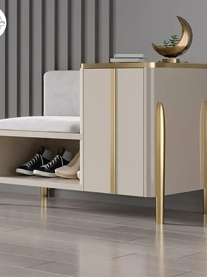A shoe storage unit that includes a comfortable seating bench. This design is perfect for entryways, allowing you to sit while putting on or taking off shoes, with storage neatly tucked away.