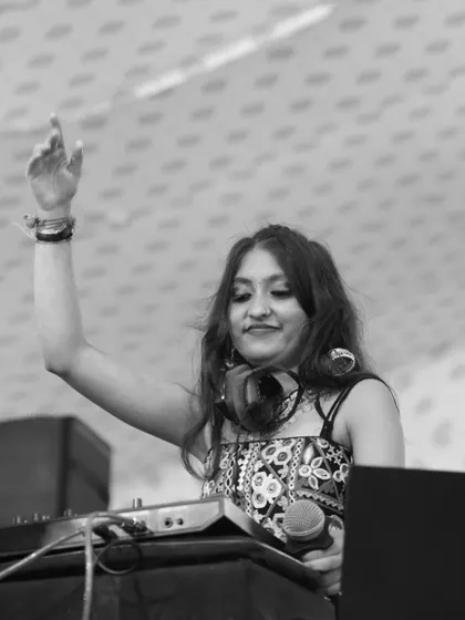 With one hand on the deck and the other in the air, I'm fully immersed in the performance. This is how I ensure a high energy dandiya night from start to finish.