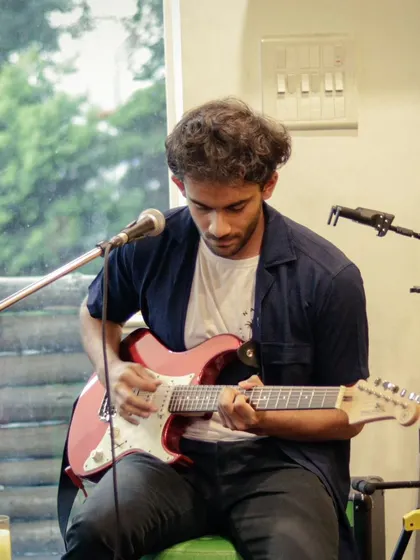 A student guitarist delivering a skillful solo during a recital. These moments of individual brilliance are fantastic to witness.