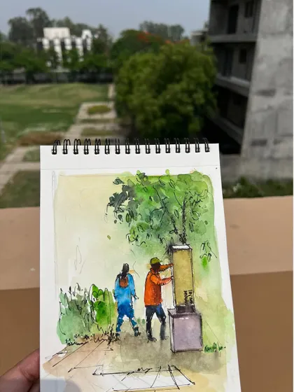 My sketchbook with the "People at Work" painting, held up against the backdrop of my neighborhood.