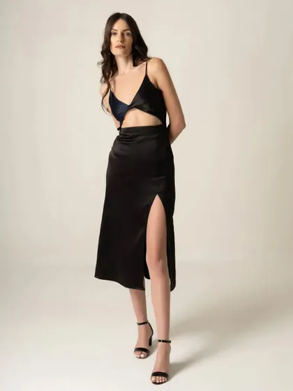 Another standard e-commerce shot of the black dress. Providing multiple angles and poses helps customers make a confident purchase decision.