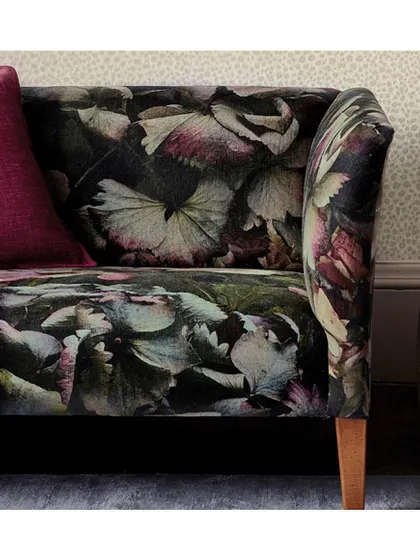 The 'COUNTESS' fabric by Zoffany is spectacular, featuring dramatic, oversized hydrangea blooms. I use such bold, painterly velvets to transform a piece of furniture into a work of art.