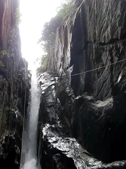 Setting up a traverse line across the top of a waterfall in Knotty Canyon. This is an advanced technique for moving the team safely in high-risk areas.