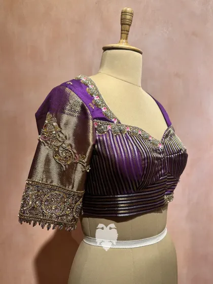 A story of devotion woven in silk. This purple blouse, inspired by the Janaki Rama concept, features delicate embroidery with zardosi, threads, and beads.