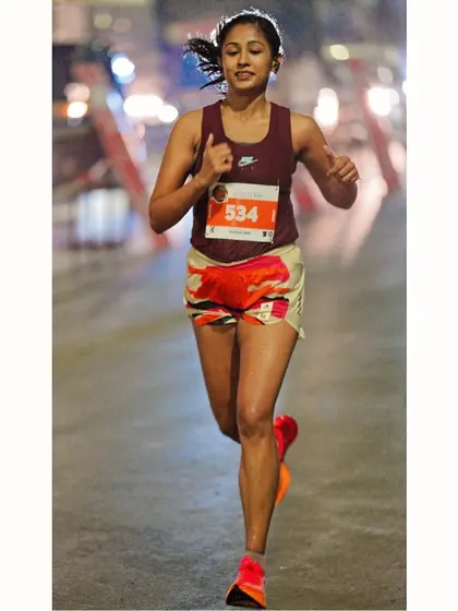 Moving with strategy, not emotion. This picture captures the focus required to achieve a personal best and a win for the fourth year in a row at the Pune International Marathon.