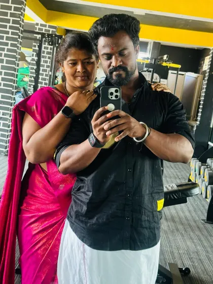 My happiness. My wife is my strength. A mirror selfie together at the gym.