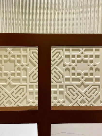 Intricate details of the home temple, featuring a CNC-cut jali panel. This modern take on a traditional craft adds a delicate and spiritual touch.