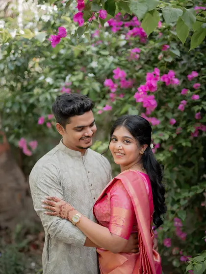 A lovely portrait of the engaged couple, with the bride-to-be looking at the camera while her fiancé looks at her.