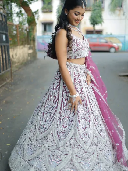 A candid, twirling shot that shows the beautiful movement and flare of the lehenga skirt.