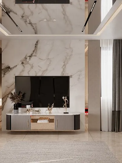 A bedroom TV and lounge area where we executed the installation of a marble feature wall and a mirrored ceiling. The bay window seating with built-in storage was also constructed by our team.