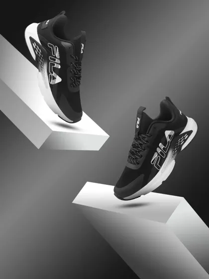 A dynamic composition for Fila sneakers. I used geometric blocks and a monochrome background to make the shoes pop, creating a sense of motion and modern style.