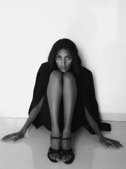 A powerful and striking black and white portrait. The composition is unusual and artistic, creating a memorable image.