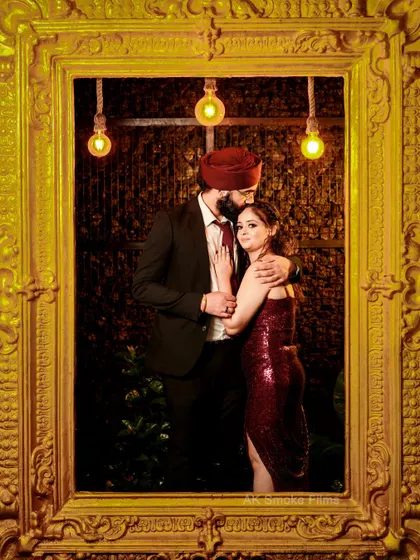 A tender moment from the same shoot, with the groom kissing his fiancée's forehead.