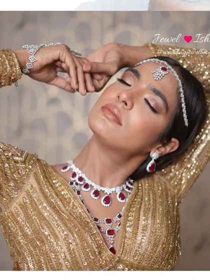Lost in the moment, adorned in sparkle. The way the light catches this ruby and diamond set is just magical. It’s perfect for the bride who wants to feel like a movie star on her special day.