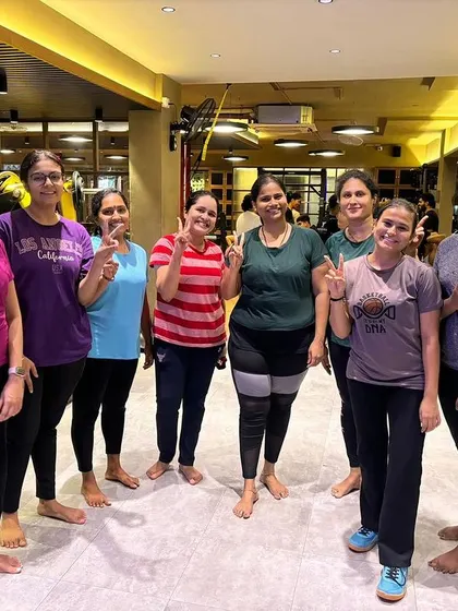 Our members posing together after a yoga or mobility session. This shows the calmer, more focused side of our community, dedicated to all aspects of wellness.