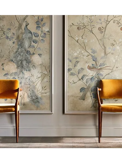The 'Rotherby' wallpaper, featuring peacocks on blossom branches, can be used as panelled art. This application adds a contemporary, ethereal touch to a hallway or sitting area.
