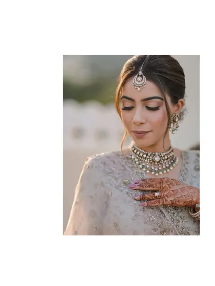 A close-up bridal portrait focusing on the bride's makeup and delicate expression.