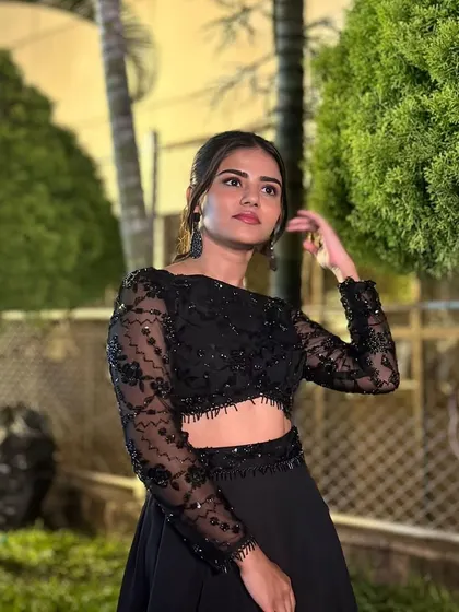 A close-up of Meghana, her simple styling letting the outfit do the talking.
