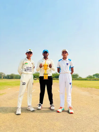 The captains and umpire with the trophy, ready for the big final.