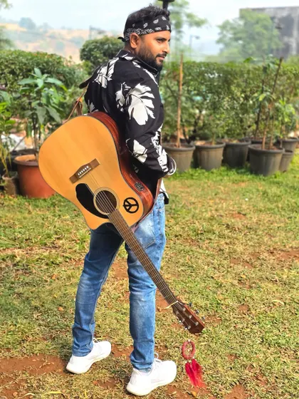 "Music isn't what I do, it's who I am." Carrying my guitar on my back, always ready for the next musical adventure.