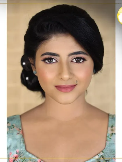 A close-up portrait of this soft and pretty makeup. The skin is glowing, and the lip color adds just the right amount of polish.