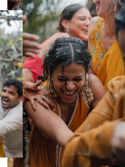 A candid shot of the bride laughing uncontrollably as she's surrounded by friends and family during her Haldi.