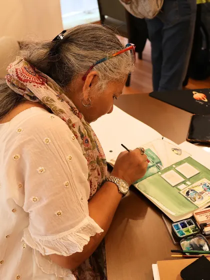 An artist from the @uskbengaluru group is captured in a moment of focus, sketching the gallery's interior and artworks. We love seeing our space become a source of inspiration.
