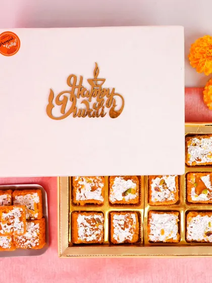 For the ultimate sweet tooth, I offer this premium "Happy Diwali" gift box. It's filled with decadent squares of a traditional dry fruit barfi, a rich and wholesome mithai perfect for celebrating the festival of lights.