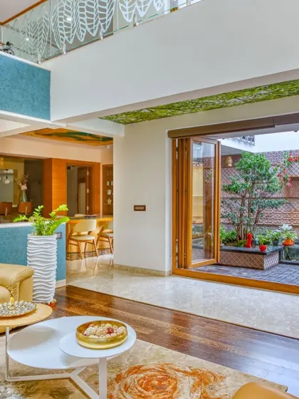 The living room of "A Home by the Park" opening up to the central courtyard, featured in "77 Stunning Indian Homes."