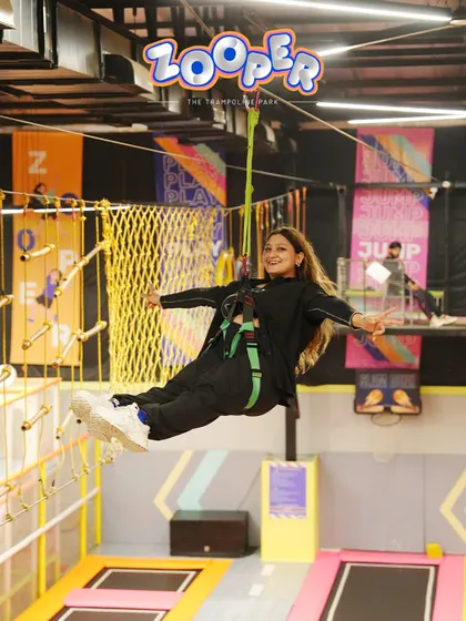 Flying through the air on the zipline with a huge smile. This is one of the most thrilling experiences I offer in the Adventure Zone.