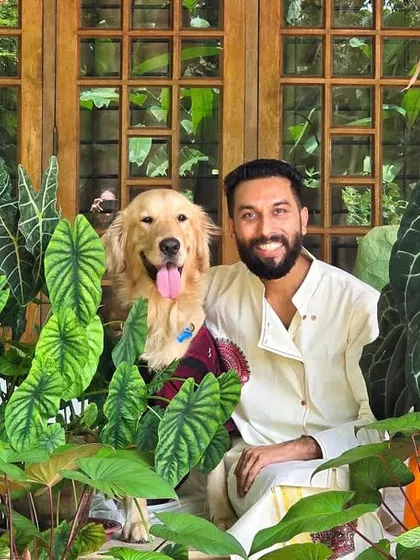 My dog Leo posing with me amongst the Anthuriums and other foliage plants. He is a natural in the garden.