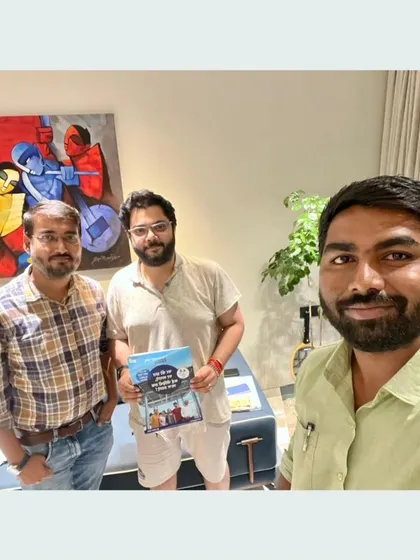 Our team with a customer holding our "Built for Generations" booklet.