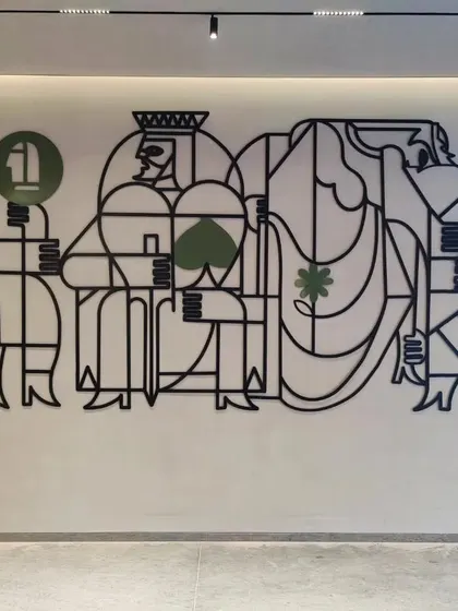 The full view of the 'Queen's Gambit' metal line art installation in its intended space.