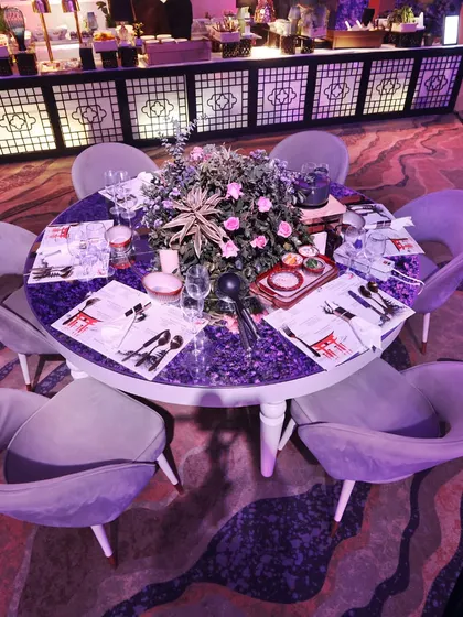 An elegantly set table featuring our custom "Curry Nama" placemats. This attention to branded detail ensures a cohesive and immersive experience, reinforcing the unique culinary concepts we bring to your event.