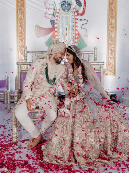 A moment of pure joy as the couple is showered with petals during their wedding ceremony at the beautiful ITC Maratha. We focus on capturing these candid, unscripted emotions that define your big day.