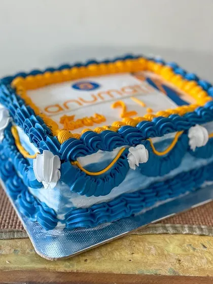 A vintage-style sheet cake for the 2nd anniversary of Anumati. I used their brand colors for the buttercream piping and included their logo and mascot for a personalized corporate celebration cake.