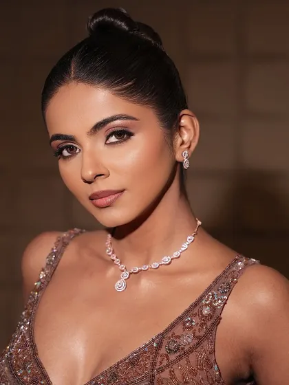 Another angle of this glamorous look. The brown eye makeup and glossy lips are a classic combination that works beautifully for evening events.